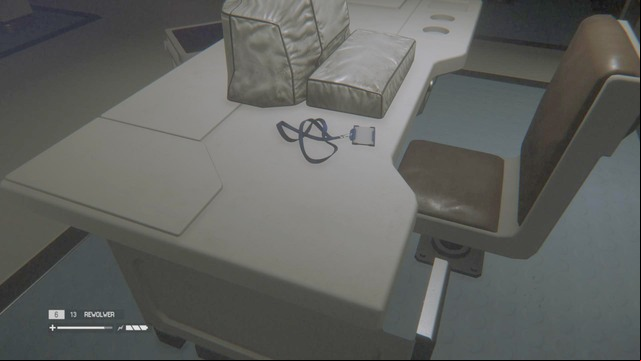 An ID Tag lies on a desk next to the door - Seegson Synthetics - Missing persons and Archive Logs - Alien: Isolation - Game Guide and Walkthrough