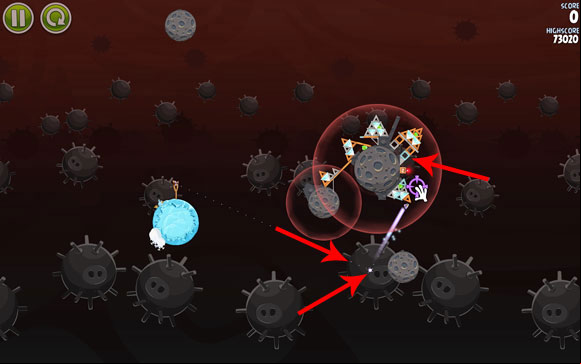 Launch the first bird towards the smaller planet - the flight path ing right next to the gravity field - Level 3-26 - Danger Zone - Angry Birds Space - Game Guide and Walkthrough