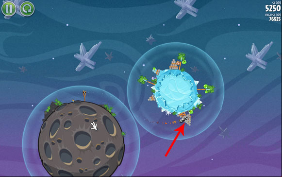 Adjust the flight path to go through the area where the gravity fields are the closest to each other - Level 2-8 - Cold Cuts - Angry Birds Space - Game Guide and Walkthrough