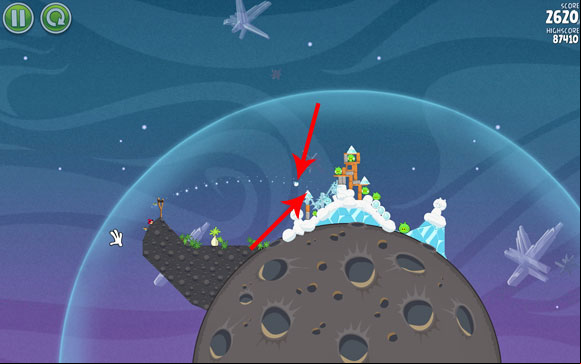 Launch the second bird so that its flight path goes a bit above the frozen triangle indicated on the above screen - Level 2-7 - Cold Cuts - Angry Birds Space - Game Guide and Walkthrough
