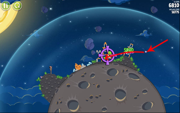 Once it's at the indicated spot, turn it in the direction of the structure with three pigs in it, so that it es through the planks ing the pig on the right - Level 1-22 - Pig Bang - Angry Birds Space - Game Guide and Walkthrough