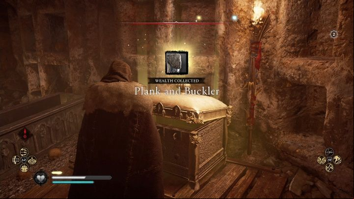 Inside you will immediately notice a golden box that contains a heavy shield - Assassins Creed Valhalla: Gear - East Anglia secrets, locations - East Anglia - Assassins Creed Valhalla Guide and Walkthrough