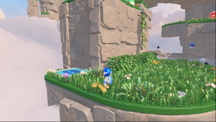 Get back on the grass and find the blue trampoline that will take you to the next level - Astros Playroom: Gusty Gateway - walkthrough - Memory Meadow - Astros Playroom Guide