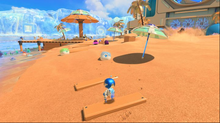 Go back to the checkpoint and collect the coins from the blue and green canisters - Astros Playroom: Bot Beach - walkthrough - Cooling Springs - Astros Playroom Guide