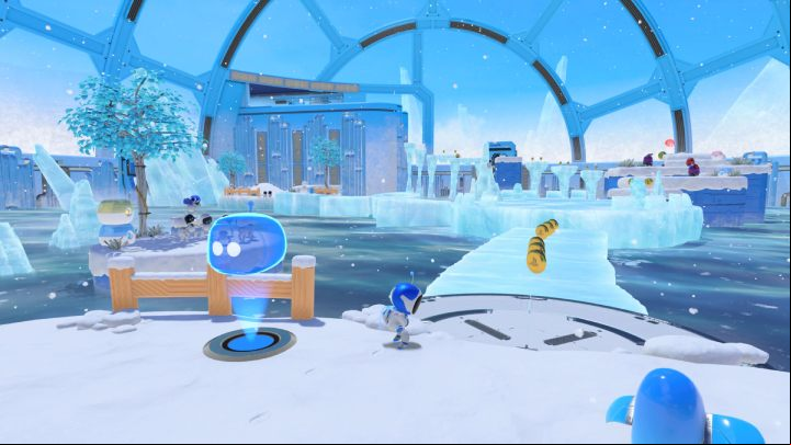 Enter the ice bridge and then jump to the small island on the left and pick up coins from the canisters - Astros Playroom: Frigid Floes - walkthrough - Cooling Springs - Astros Playroom Guide