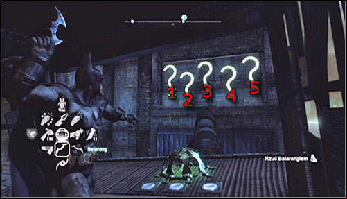 After reaching the area where the Trophy is hidden, stand on the pressure plate and note that by doing that you have causes the question marks to light up - Batman trophies (29-37) | Amusement Mile - Amusement Mile - Batman: Arkham City Game Guide