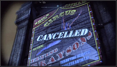 Find the giant circus poster on the wall of the building (screen above) and scan it - Riddles | Amusement Mile - Amusement Mile - Batman: Arkham City Game Guide