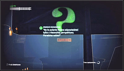 Examine the back of the billboard in Detective Mode and you should note that theres a question mark painted on it - Riddles | Amusement Mile - Amusement Mile - Batman: Arkham City Game Guide
