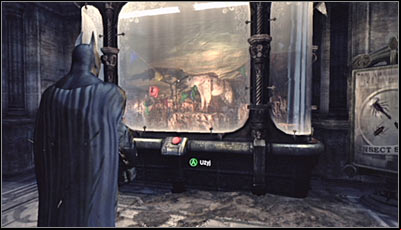O your way to the main part of the War Room, find the hyena exhibit (screen above) and scan it - Riddles | Museum - Museum - Batman: Arkham City Game Guide