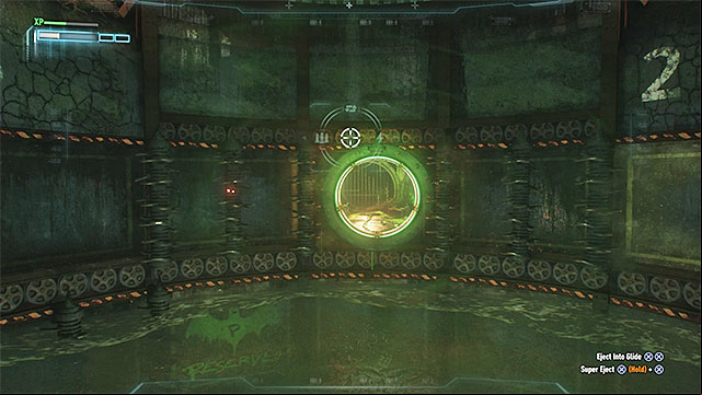 Keep lowering the batmobile, up to the point at which it is located right above the operating drills - Seventh Riddler trial | Batman Arkham Knight - Riddlers Revenge - Batman: Arkham Knight Game Guide & Walkthrough