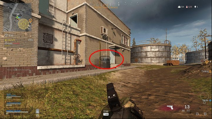 The image above shows one of the team tagging a rifle in a building across the street - Warzone: Communication - Basics - Warzone Guide