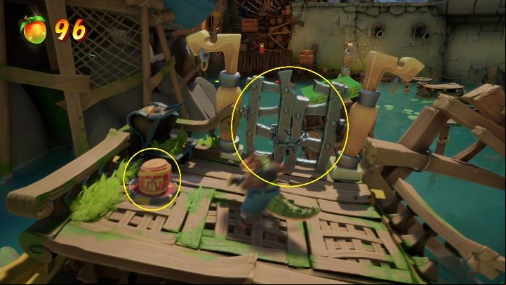 Your next move should be to take a barrel of TNT and hit it straight into the closed age - Crash 4: Thar He Blows! walkthrough - Salty Wharf, 1717 - Crash 4 Guide, Walkthrough