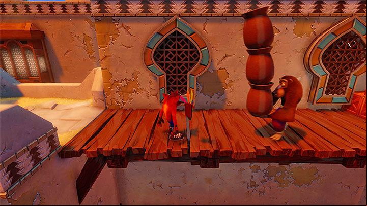 Take several jumps to reach the rooftop of the first building - Hang Em High | Crash Bandicoot 3 | Levels - Crash Bandicoot 3 - Arabic location - Crash Bandicoot N. Sane Trilogy Game Guide