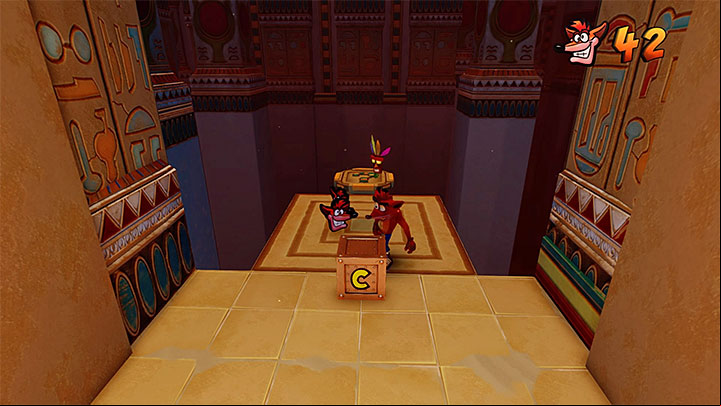 In the next corridor, watch out for the lit points on the ground which activate traps, and for green crates with nitroglycerine - Sphynxinator | Crash Bandicoot 3 | Levels - Crash Bandicoot 3 - Egyptian location - Crash Bandicoot N. Sane Trilogy Game Guide