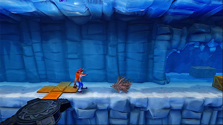 Right after the beginning of the stage, start sliding over ice and, at the right moment, take a jump to avoid the chasm - Snow Biz | Crash Bandicoot 2 | Levels - Crash Bandicoot 2 - Ice Warp Room - Crash Bandicoot N. Sane Trilogy Game Guide