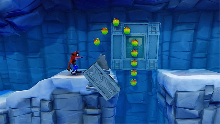 Slide over the ice at the right moment to avid the trap - Snow Biz | Crash Bandicoot 2 | Levels - Crash Bandicoot 2 - Ice Warp Room - Crash Bandicoot N. Sane Trilogy Game Guide