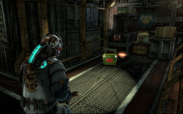 After you climb down the ladder, in the hall filled with containers, turn right where the path forks - Chapter 5 | Secrets - Secrets - Dead Space 3 Game Guide
