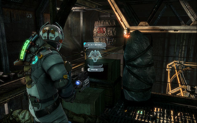 After you climb the ladder, right in front of the door to the large hall filled with containers - Chapter 5 | Secrets - Secrets - Dead Space 3 Game Guide