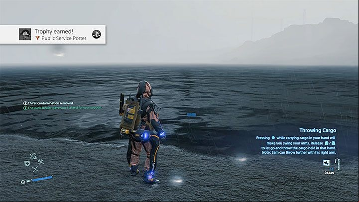 While holding the cargo (hold the L2 and R2 buttons), press the Square throw the container - Public Service Porter trophy | Death Stranding - Trophy Guide - Death Stranding Guide
