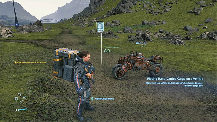 The first three-wheeled motorcycle is parked near the Distribution Center West of Capital Knot City - How to get and start a new motorcycle in Death Stranding? - Exploration and cargo transportation - Death Stranding Guide
