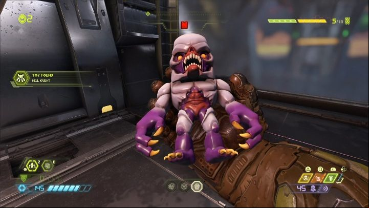 To open the age to this doll, you need to shoot at the green button located near the ceiling - Doom Eternal: Doom Hunter Base secrets maps and location - Collectibles and secrets - Doom Eternal Guide