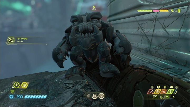 The figurine is located on a rock ledge on the left side of the building - Doom Eternal: Urdak secrets maps and location - Collectibles and secrets - Doom Eternal Guide