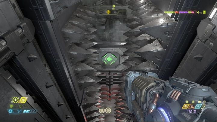Shoot the button immediately after the spikes are moving away from each other, and aim the jump so that you will able to fall down, through an open age and grab the wall - Doom Eternal: Cultist Base walkthrough - Levels walkthrough - Doom Eternal Guide