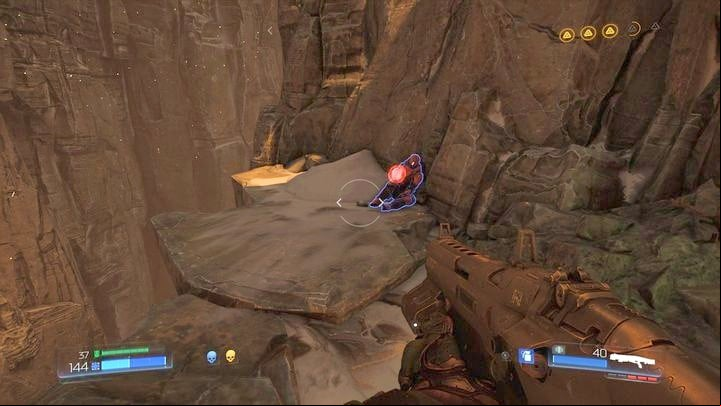 Go back to the tunnel exit where you were attacked by Cacodemon before you walk through the large black gate - Doom: All secrets in Kadingir Sanctum - Secrets - Doom Game Guide & Walkthrough