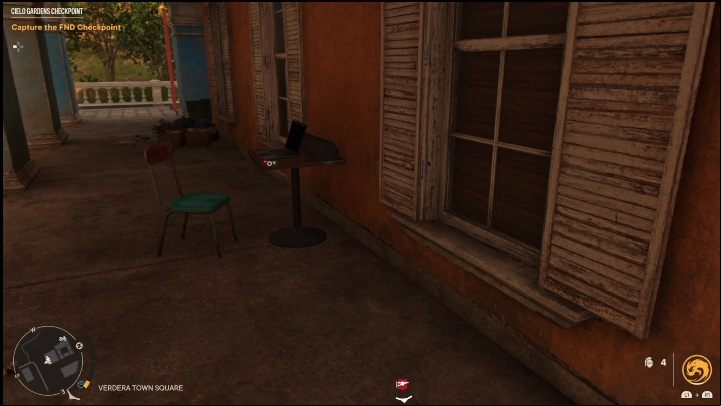 This USB Stick lies on a small, wooden table next to a laptop - Far Cry 6: USB Songs - list, locations - Other - Far Cry 6 Guide