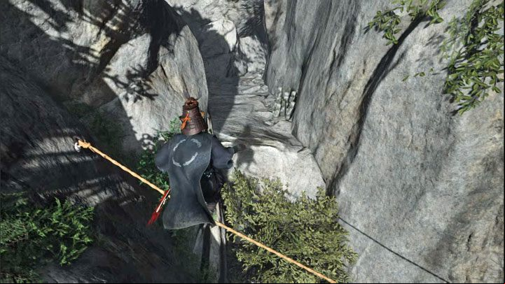 While balancing on the suspended line, jump towards the rock ledge to the side - Ghost of Tsushima Iki Island: How to reach Saruiwa peak? - Secrets and Collectibles - Ghost of Tsushima Guide, Walkthrough
