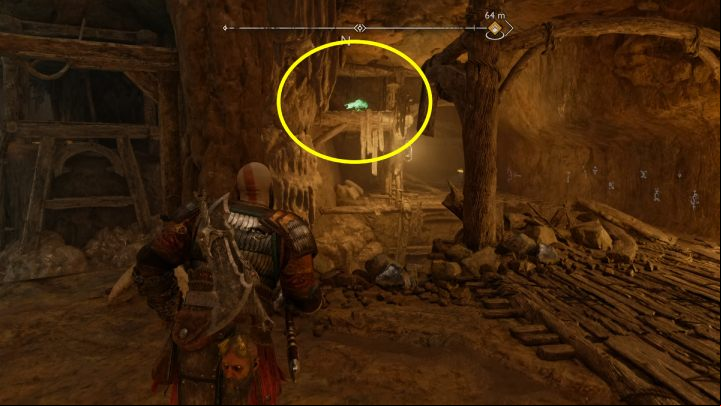 The bird sits on a wooden beam near a large door - God of War Ragnarok: The Applecore, Svartalfheim - secrets, collectibles - Svartalfheim - God of War Ragnarok Guide