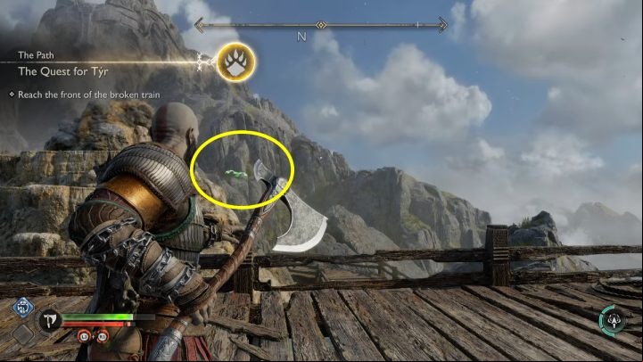 The raven flies over the tracks at the foot of the mountain, where the mining cart stops - God of War Ragnarok: The Forge, Svartalfheim - secrets, collectibles - Svartalfheim - God of War Ragnarok Guide
