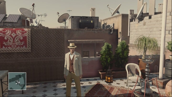 The heaster is working on his new novel on the rooftop of the carpet shop. - Disguises | Marrakesh - Marrakesh: A Gilded Cage - Hitman Game Guide