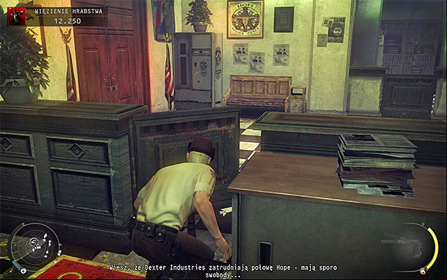 The exit from the county jail can be reached in two main ways: moving along the counter shown on the screen 1 to the right or heading to the door shown on the screen 2 (wait until recently byed cop walks to the left desk) - County jail | 16: Operation Sledgehammer - 16: Operation Sledgehammer - Hitman: Absolution Game Guide