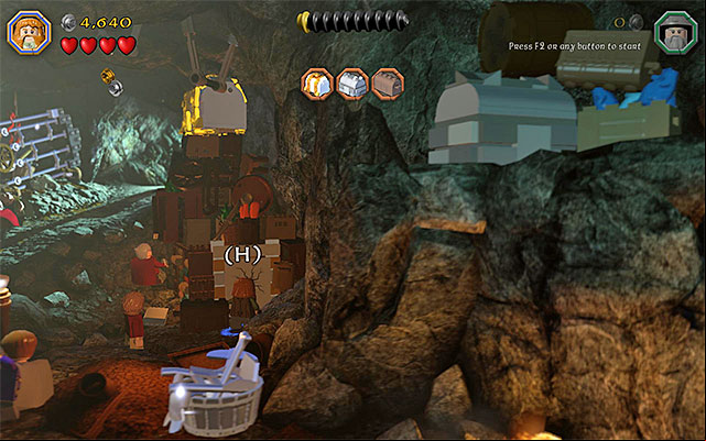 You need to use the axe on the cracked plate - Stage 5 (The Troll Hoard): Explore the cave | Walkthrough | LEGO The Hobbit - Walkthrough - LEGO The Hobbit Game Guide & Walkthrough