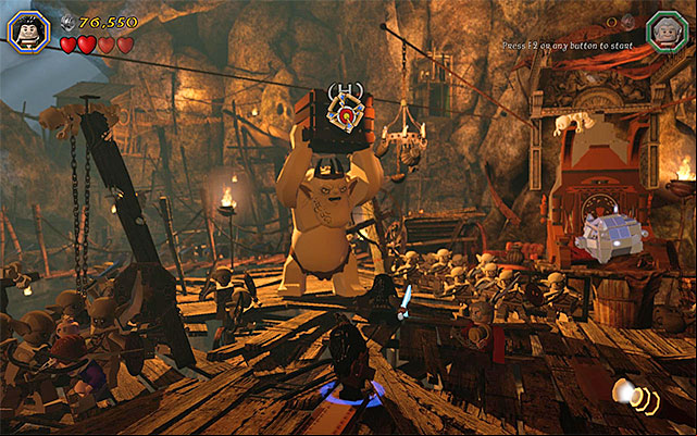 Start attacking the smaller goblins, but pay attention to the actions of the Grand Goblin - Stage 7 (Goblin-town): The first battle with Great Goblin | Walkthrough - Walkthrough - LEGO The Hobbit Game Guide & Walkthrough