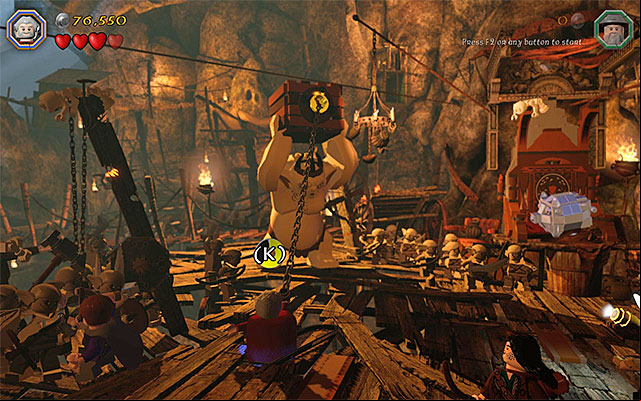 You need to use the flail on the crates catch - Stage 7 (Goblin-town): The first battle with Great Goblin | Walkthrough - Walkthrough - LEGO The Hobbit Game Guide & Walkthrough