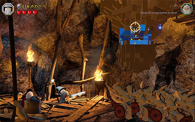 Drop down the boulder and set it into motion - Stage 7 (Goblin-town): Escape from the goblin city | Walkthrough - Walkthrough - LEGO The Hobbit Game Guide & Walkthrough