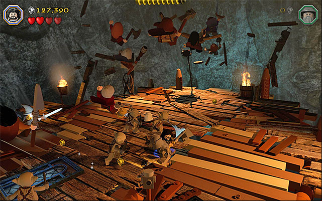 Attack the goblins and avoid stepping on the lest stable elements of the platform - Stage 7 (Goblin-town): The second battle with Great Goblin | Walkthrough - Walkthrough - LEGO The Hobbit Game Guide & Walkthrough