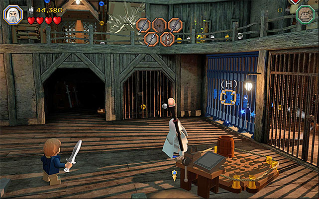 Use the staff to smash the fragment of the cage - Stage 12 (A Warm Welcome) | Main Stages - Collectibles - Main Stages - Collectibles - LEGO The Hobbit Game Guide & Walkthrough