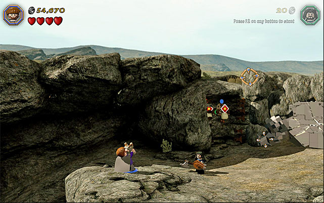 Switch to a character with slingshot now and start firing pebbles at the targets and try to bring about the situation, where above the above the target on the left, there appears a red circle, and a blue one above the one on the right - Stage 5 (The Troll Hoard) | Main Stages - Collectibles - Main Stages - Collectibles - LEGO The Hobbit Game Guide & Walkthrough