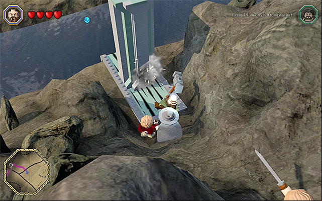 You need to push the block, using Dwalins Warhammer - Middle-Earth: Reach Troll Dwellings | Walkthrough | LEGO The Hobbit - Walkthrough - LEGO The Hobbit Game Guide & Walkthrough