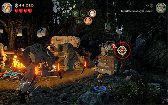 Find a Bow lying on the ground, pick it up (any character) and go towards the right side of the camp - Stage 4 (Roast Mutton): Rescue the allies | Walkthrough | LEGO The Hobbit - Walkthrough - LEGO The Hobbit Game Guide & Walkthrough