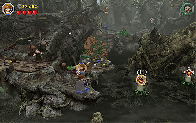 As Dwalin, leap towards the ledge, approach the big block from the left side and hit it with Dwalins Warhammer to move it to the right and smash it - Stage 10 (Flies and Spiders): The Dark Forest | Walkthrough | LEGO The Hobbit - Walkthrough - LEGO The Hobbit Game Guide & Walkthrough