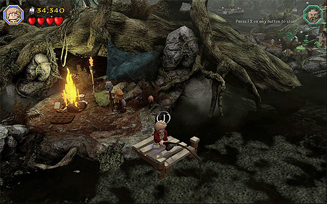 The pier where you need to complete the fishing minigame - Stage 10 (Flies and Spiders): The Dark Forest | Walkthrough | LEGO The Hobbit - Walkthrough - LEGO The Hobbit Game Guide & Walkthrough