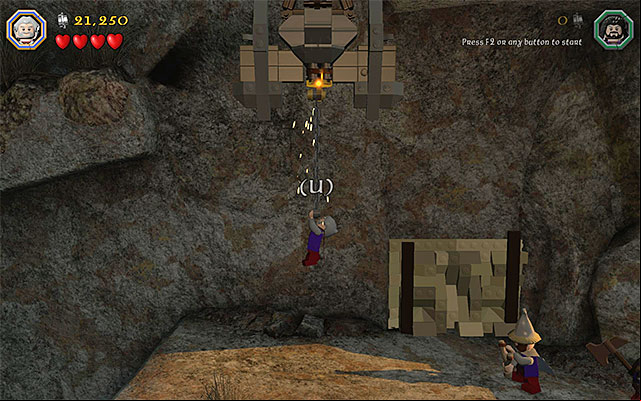 Go left and stop only after you reach the interactive catch shown in the above screenshot - Stage 15 (On the Doorstep): The climb | Walkthrough - Walkthrough - LEGO The Hobbit Game Guide & Walkthrough