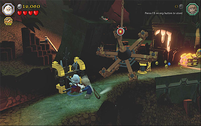 After you destroy the weapon stand, you will be able to collect the bow - Stage 16 (Inside Information): The vault | Walkthrough - Walkthrough - LEGO The Hobbit Game Guide & Walkthrough