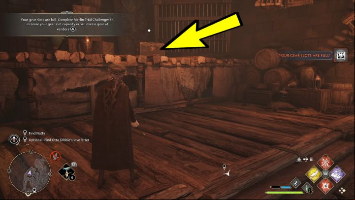 Climb the stairs between the large wooden crates and jump onto the platform - Hogwarts Legacy: A Basis for Blackmail - Relationship quests - Natty - Hogwarts Legacy Guide