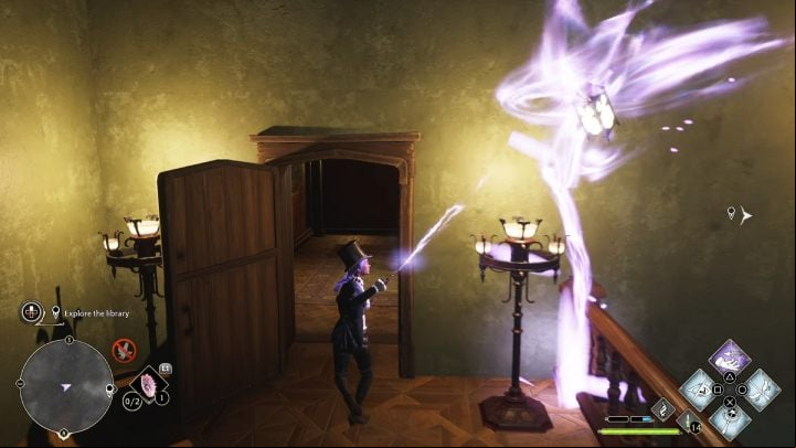 As you bring the lantern closer, a door will appear and open before you - Hogwarts Legacy: How to explore the library in the Minding Your Own Business quest? - Combat and exploration - Hogwarts Legacy Guide