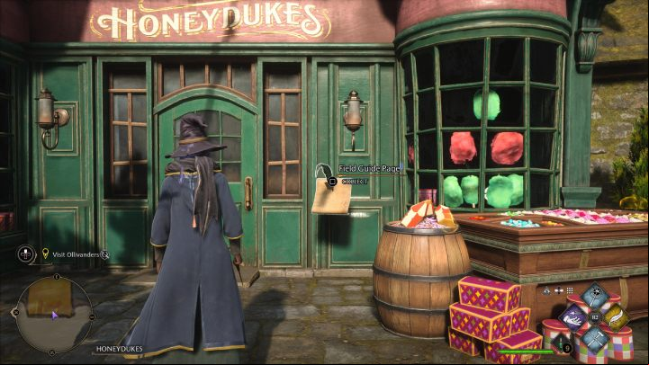 The next page is in front of the candy store entrance - Hogwarts Legacy: Field Guide Pages Part 2 - Hogsmeade - Hogsmeade - Hogwarts Legacy Guide
